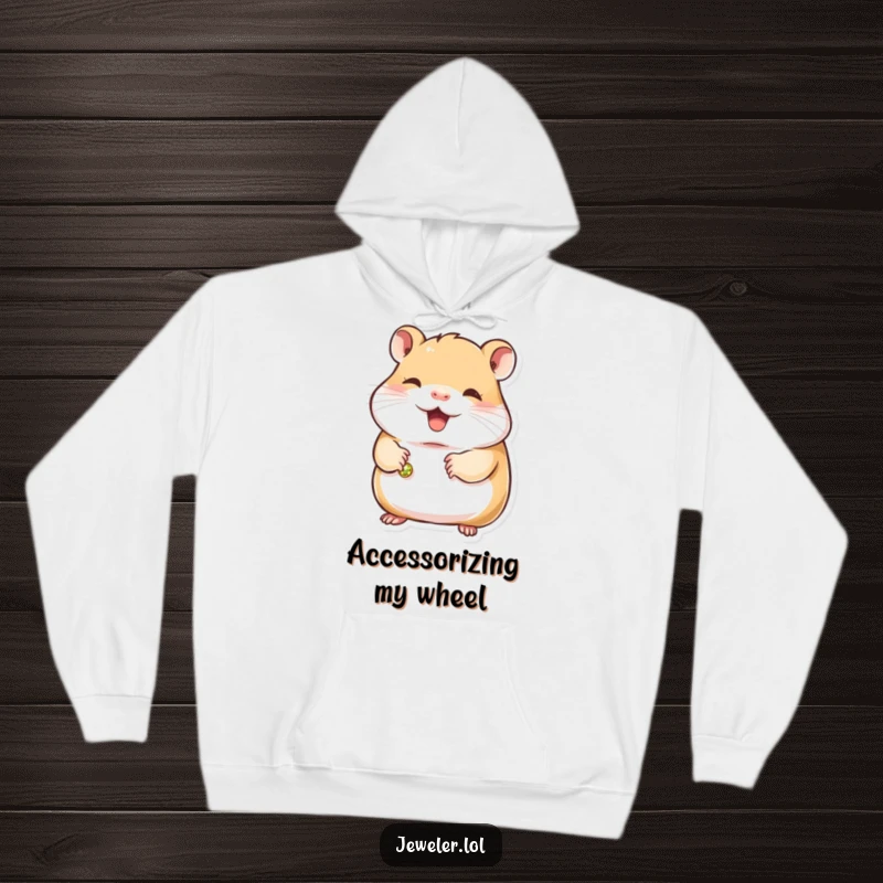 Funny hamster hoodie showing a contented hamster holding a small, gleaming bracelet, radiating sweetness and a fondness for sparkly accessories.